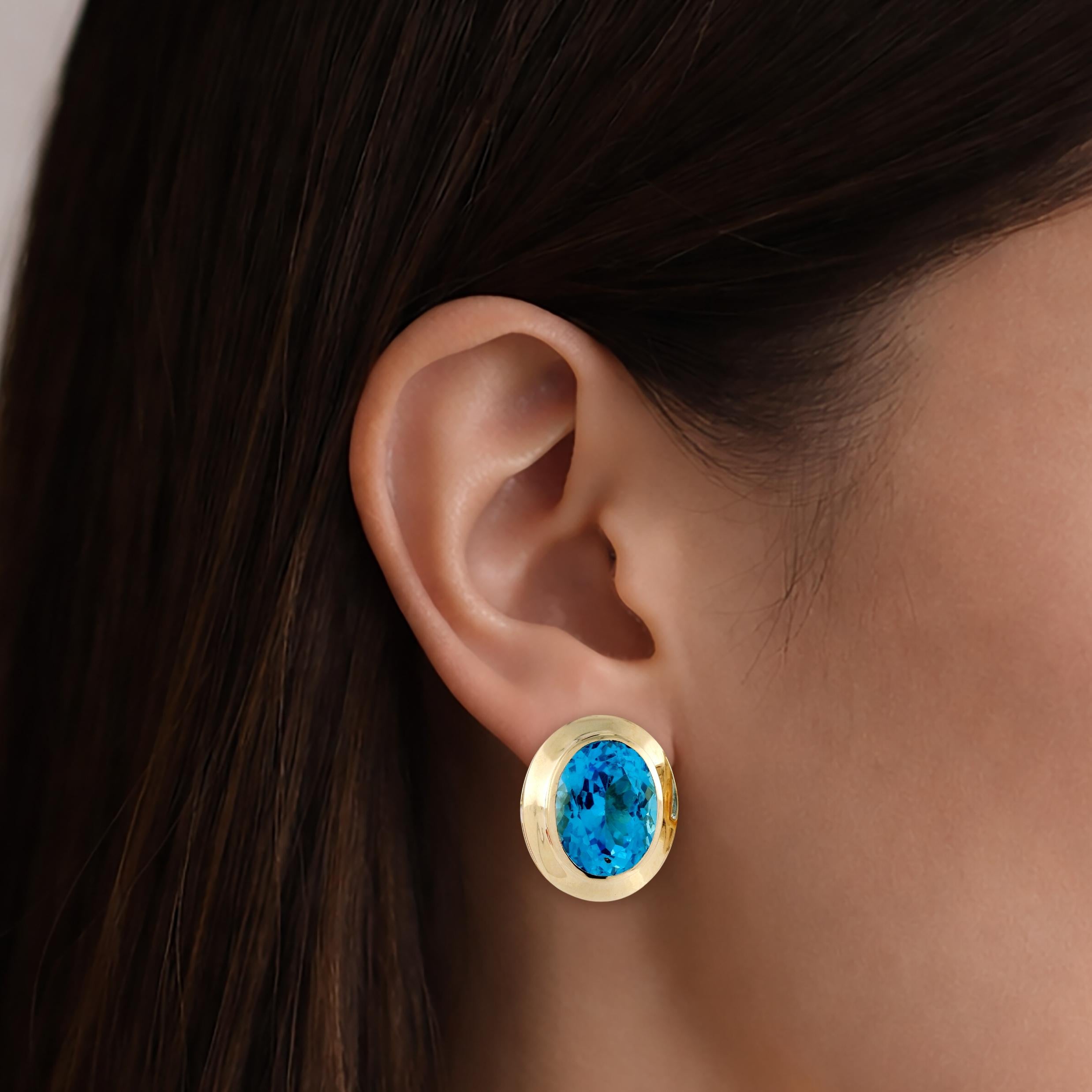 Yellow Gold 22ctw Oval Blue Topaz Bezel Set Lever Back Earrings
